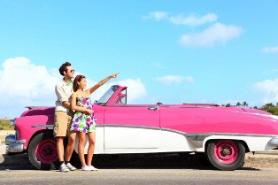 young couple with convertible